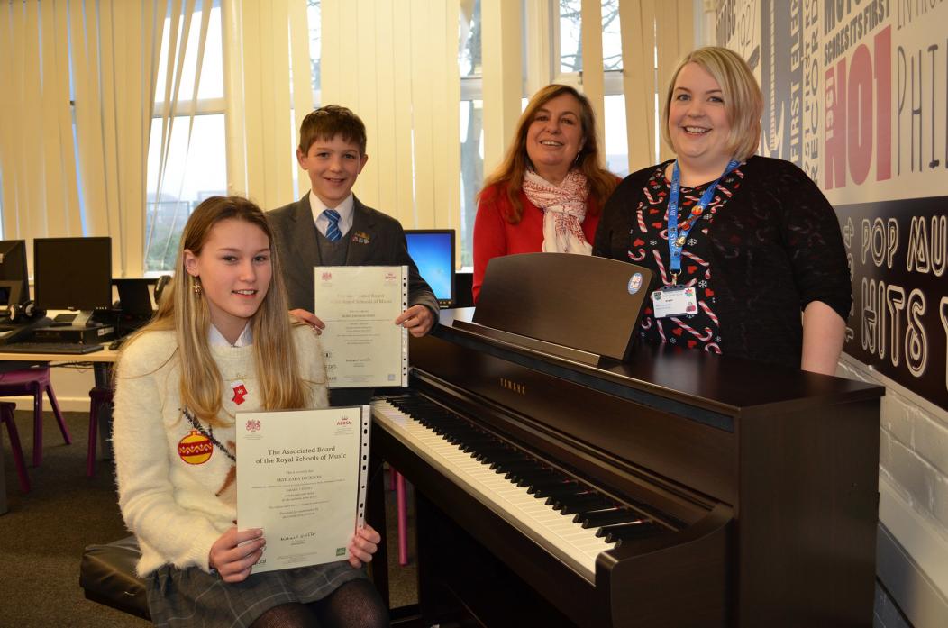 YOUNG TALENT: Budding pianists Skye Dickson and Rory Hart have achieved musical success. They are pictured with Andrea Ballentine and Sally McGrath