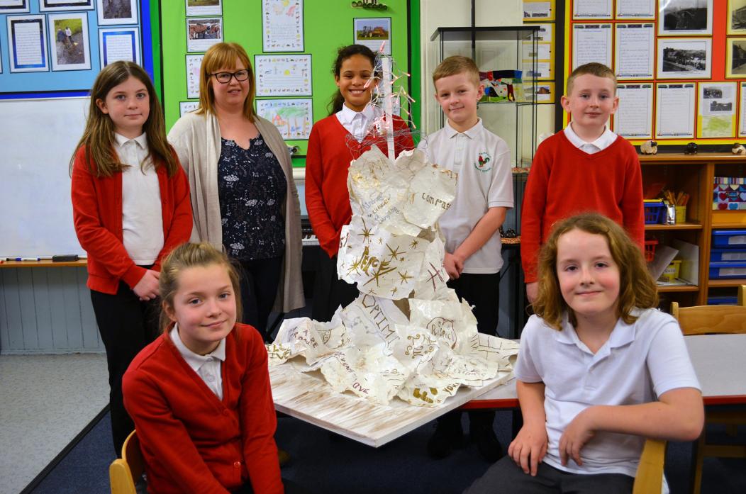 HOLOCAUST ART: Artwork created by school children will go on display at County Hall. Teacher Lyndsey Hargraves with class four pupils Adele, Mia, Michaelia, Logan, Cole and Alex TM pic
