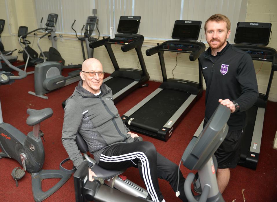FIT FOR PURPOSE: Head of PE at Staindrop academy Chris Hughes shows resident Les Blair, left, how to operate some of the equipment at the village’s new community gym                               TM pic