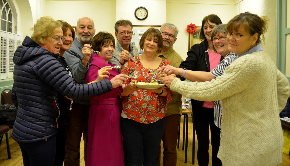 TASTY TREAT: Members of the Stainton Health and Wellbeing Club tuck into a baked cheesecake during their most recent meeting. The club meets at the village hall on a Wednesday tea time						     TM pic