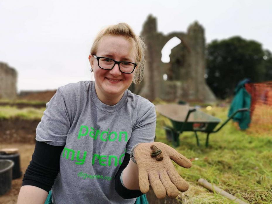 HOLY ISLAND FIND: Anna Wood displays a finger bone with rings