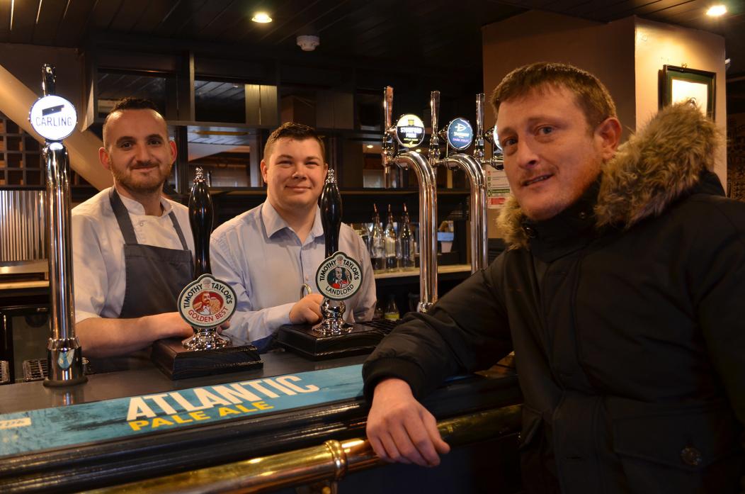CHEERS! Publican Warren Crisp has taken over the reins at The Red Well Inn. He is pictured on the right with chef Daniel Dunston and manager Nathan Glen TM pic