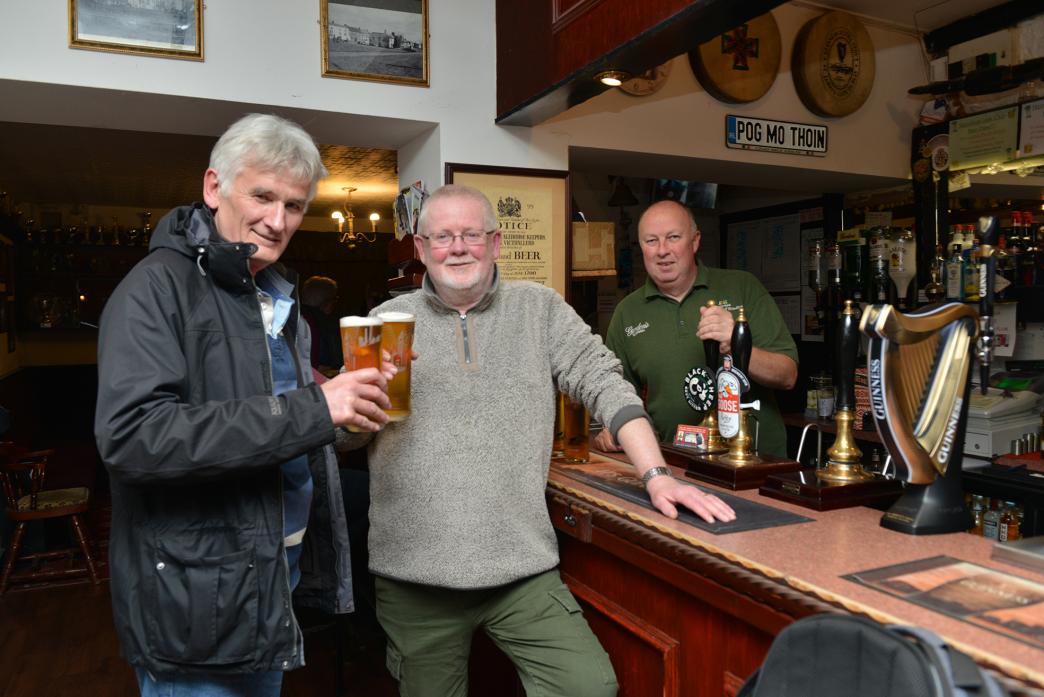 WELL EARNED BEER: Landlord Richard Fletcher serves up pints to Cllr Ed Chicken and Cllr Chris Allison to commem orate the end of their historic meeting at the Wheatsheaf Inn, in Staindrop