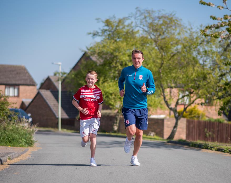 100KM CHALLENGE: Tony McMahon and son, Luca, running on their street in Cockfield