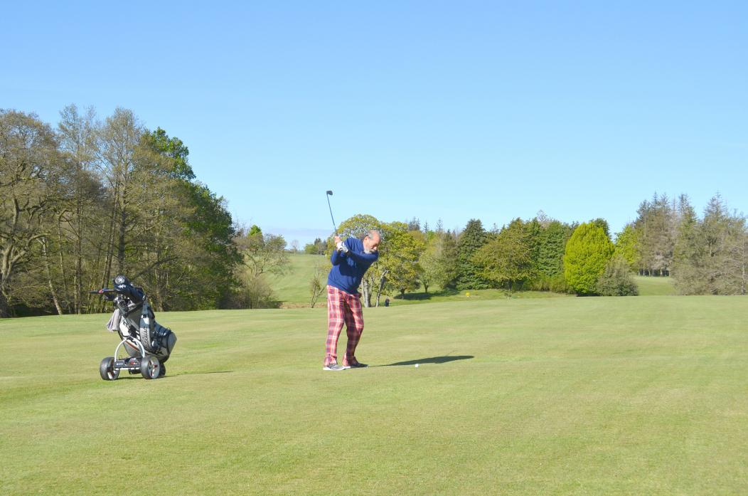 BACK IN THE SWING: Barnard Castle Golf Club member Raymond Swales plays his approach to the first hole after the course was re-opened last week