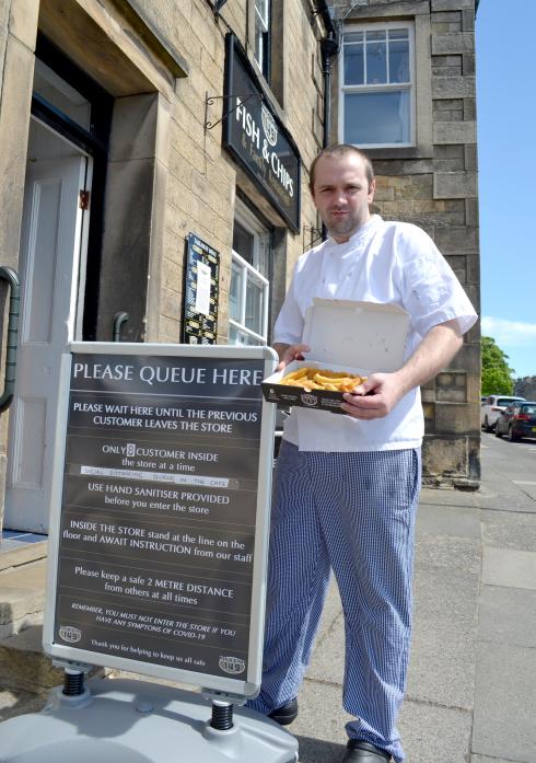 OPEN FOR BUSINESS: James Teasdale is back behind the fryer at 149 Fish and Chips, in Galgate, after measures were put in place to ensure social distancing could be maintained between customers