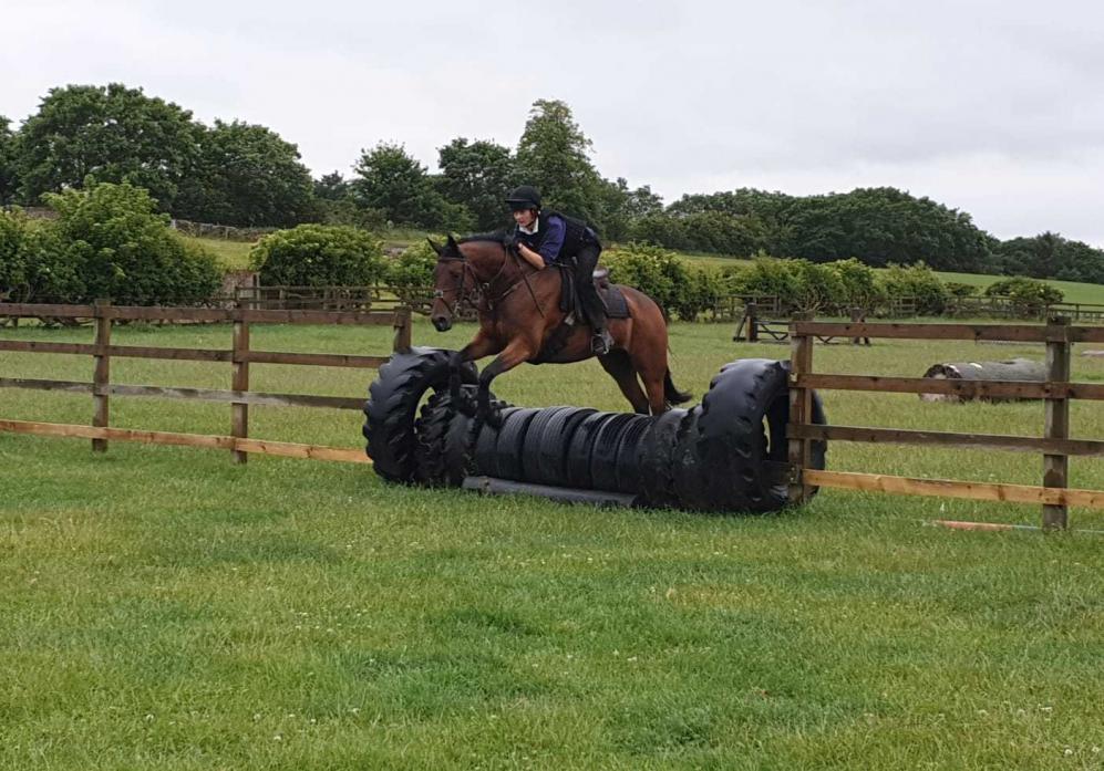 JUMP: Kirsty Hunton puts her horse, Romeo, through its paces on the Foxberry Chasers course