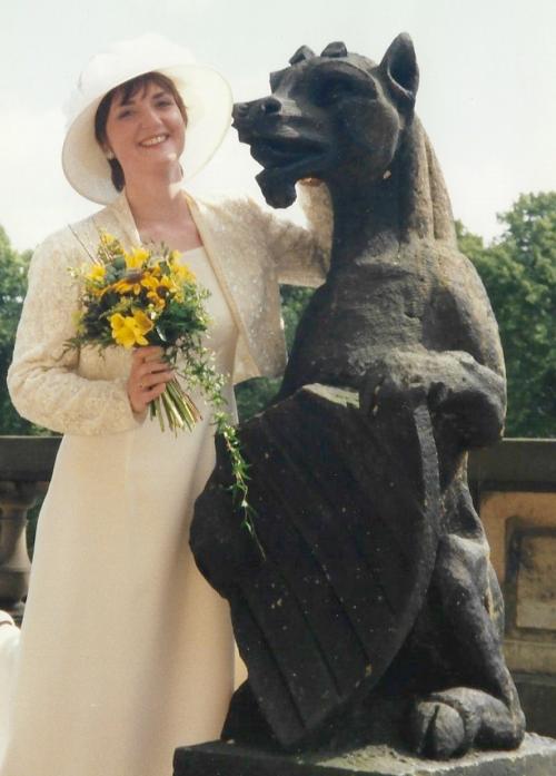 BEASTLY:  A bride some readers may recognise, poses with a beast at her reception