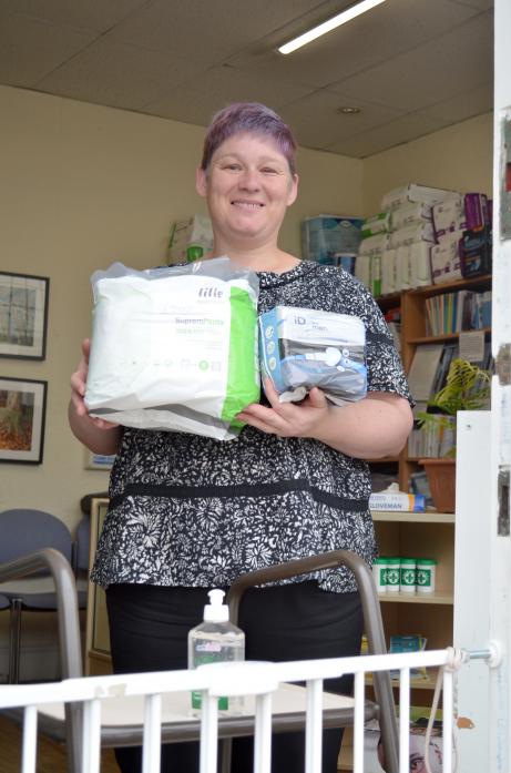 HERE TO HELP: Teesdale Disability Access Forum trustee Lindsey Rudge with some of the goods available at the shop in Market Place, which has reopened. The forum cannot offer its wheelchair loan service at the moment