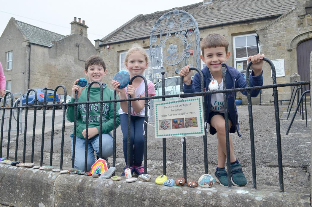 STONE ART: Pupils at Bowes School James and Kate Tiplady with Ollie Bainbridge created their own decorated stones