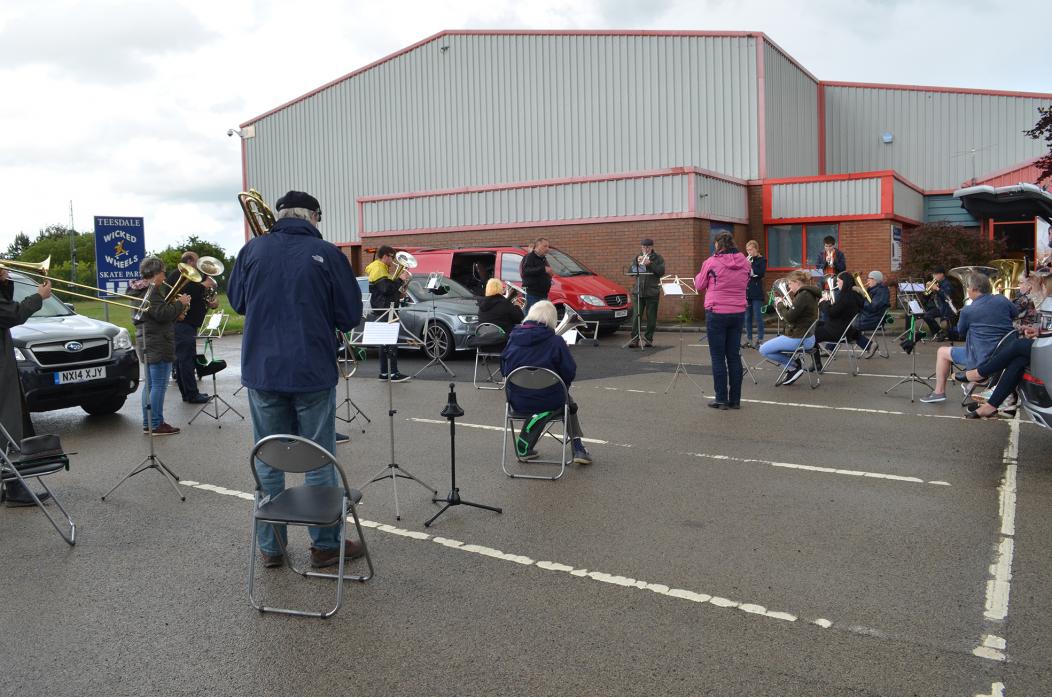 STRIKE UP THE BAND: Barnard Castle Band members braved the rain to take part in their first socially distanced practice in the open-air last month