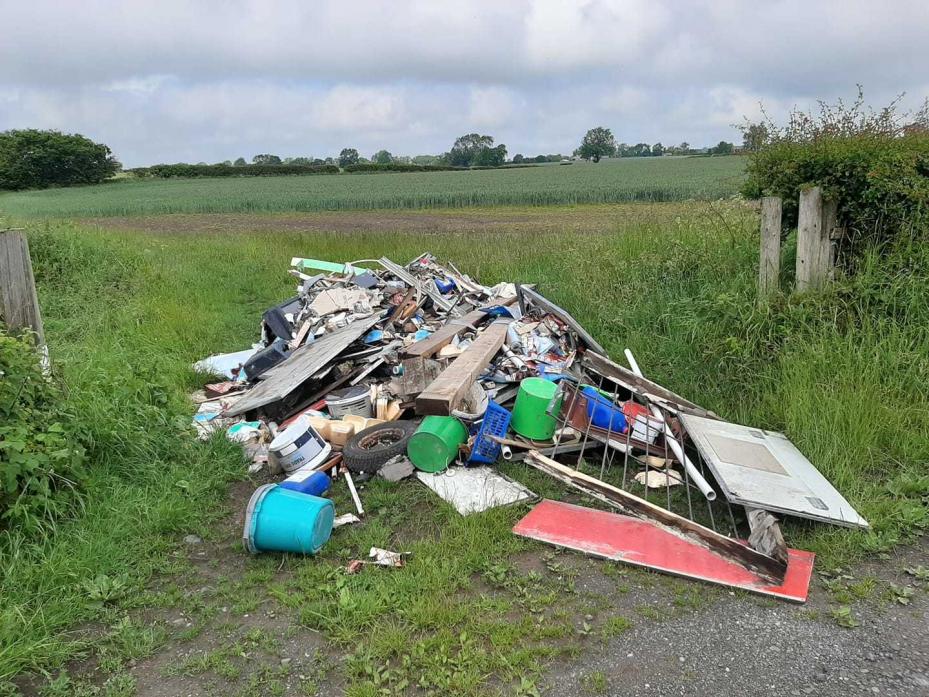 SHAMELESS: Farmer Simon Robinson will have to pay to remove the rubbish from his field