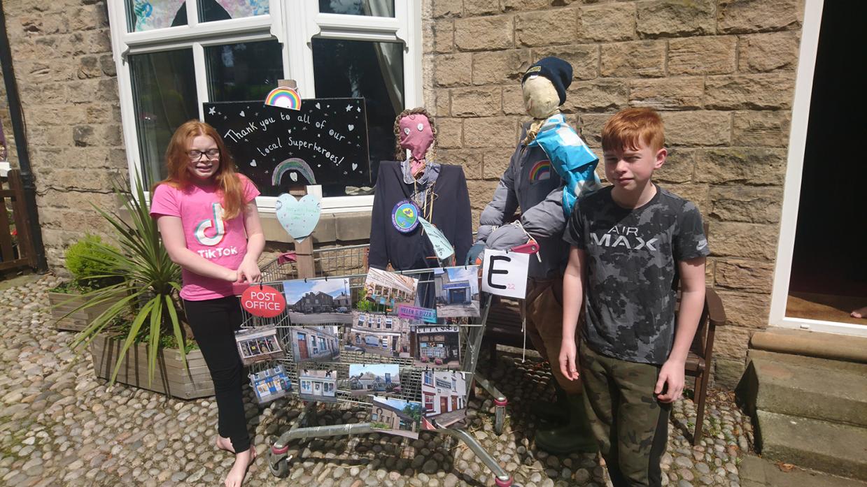 SCARECROW TRAIL: Jack and Abbey Laidlaw with their scarecrow, which forms part of a trail around Middleton