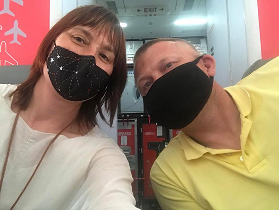 LOCKDOWN: Louise and David Finlay on the flight home from Spain
