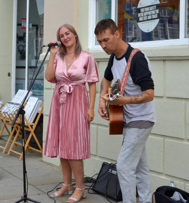 ON SONG: Singer Louise Beagle and musician Darren Stubley entertained shoppers in Barnard Castle with an impromptu busking session