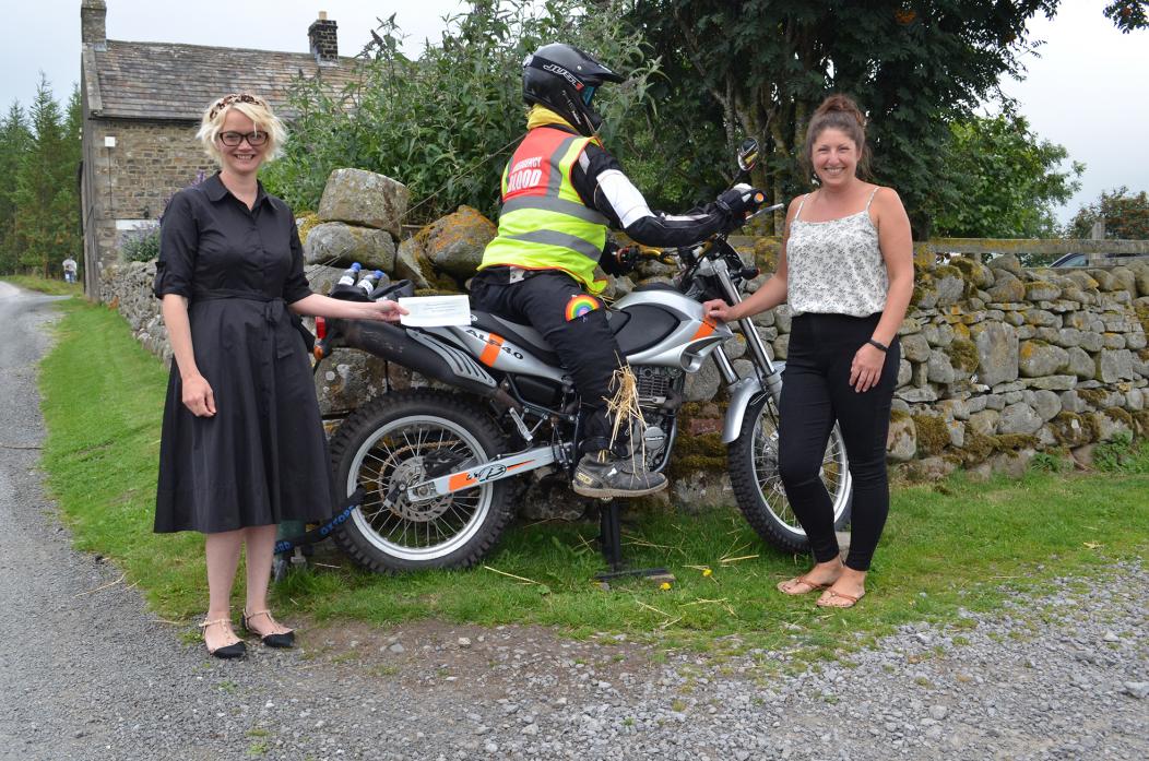 WINNER: Emergency blood biker complete with fake blood took the top prize in Holwick’s first scarecrow trail for Helen Knowles, pictured here with Dr Heather MacConachie, left