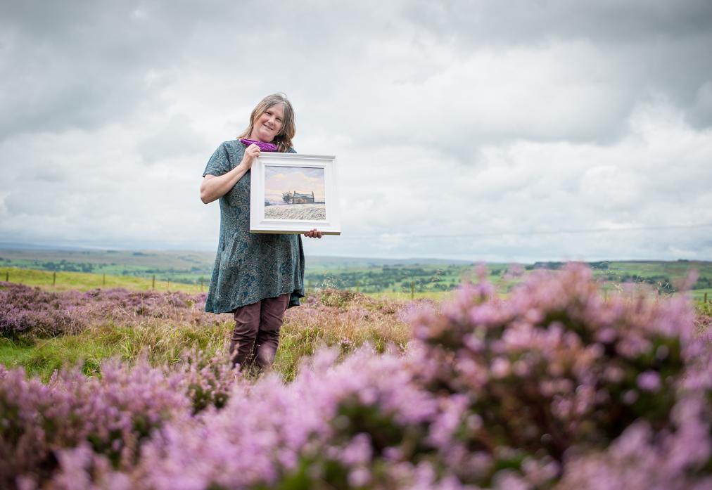 OPEN STUDIO: Anne Mason with her latest piece, inspired by the fells near her home and studio at Folly Top, Eggleston