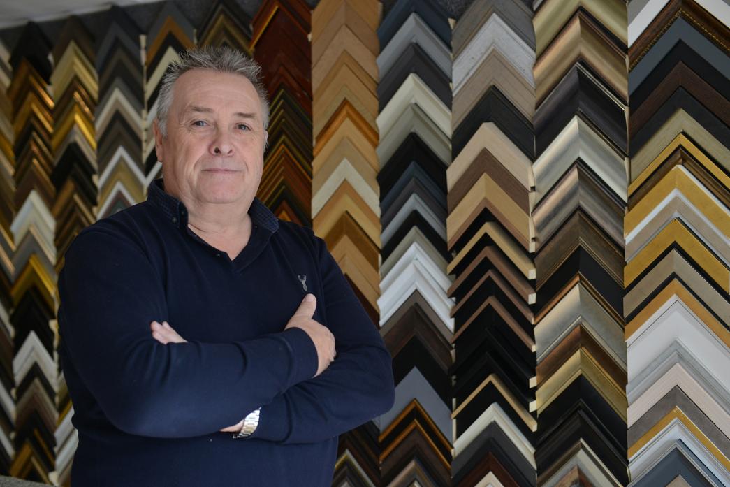 YOU’VE BEEN FRAMED: Nigel Allison with some of the extensive range of moulded frames