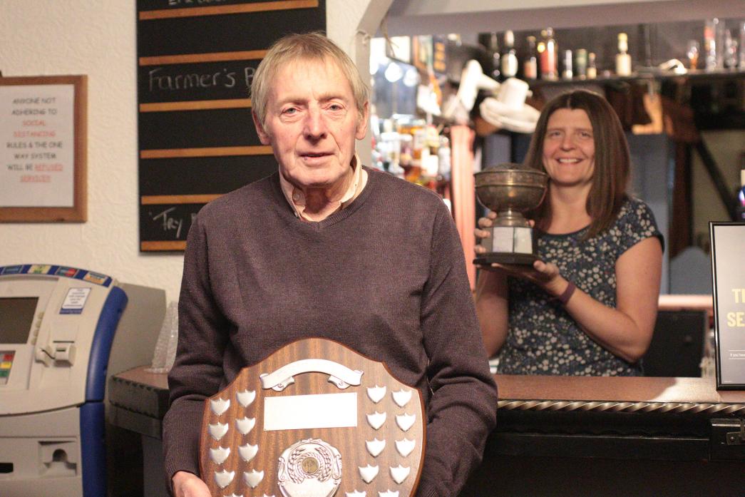 GOOD SHOW: Louise Race, of the Wheatsheaf, presented the trophy for best pot leeks to Mac Douglas