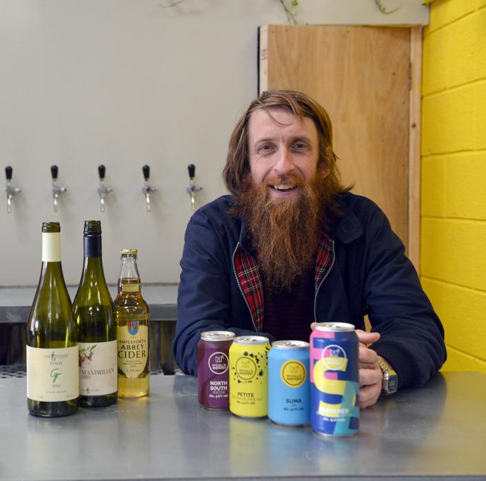 LOCAL DRINKS: Brewer Danny McColl with some of the local beers, spirits and wines on offer at his new tap room