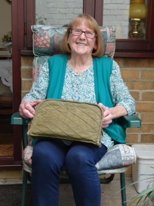 SKILLED CRAFTSMAN: Ena Gowland with the handbag that POW Willi Maass made for her using material from his uniform