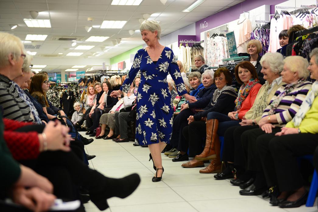 CATWALK QUEEN: Above, Jill Hedley sports a floral blue number. Right,  Chloe and Isla Cole impressed strutted their stuff during the fashion show