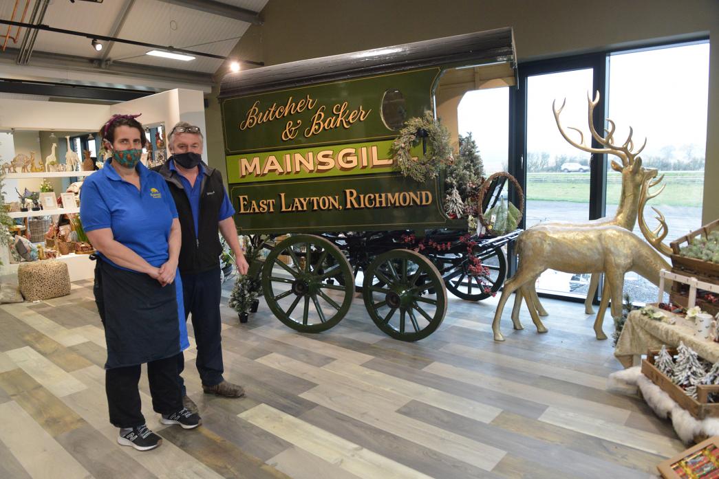 SHOPPING EXPERIENCE: Maria and Andrew Henshaw with the refurbished horse cart from the 1800s that forms a display in the expanded Mainsgill farm shop