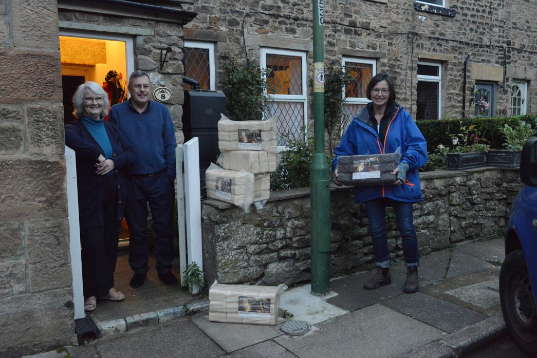 DELIVERIES: David and Judith Phillips, who have been supporters of Warm Age Wood Company since it started about 14 years ago, receive briquettes from Gerardine O’ Connor