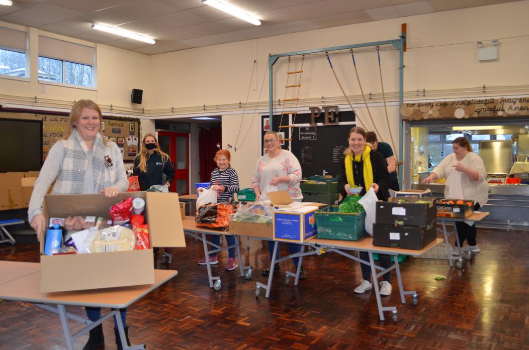 SPECIAL TREAT: Rachel Stevens with her team of helpers at Evenwood School put together 67 bumper hampers for families as a festive thank you  	      All TM pics
