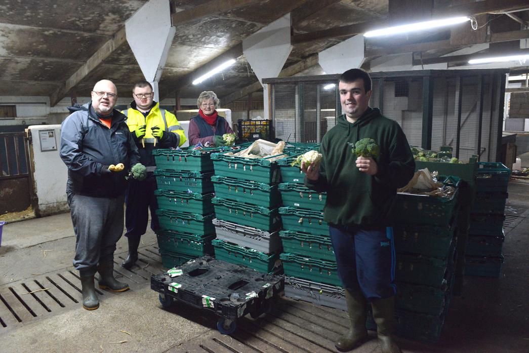 DONATIONS: Above, Volunteers Tony and Oliver Towers, Pauline Heslop and Steven Mounter with some of the six van loads of vegetables donated by Catterick’s Tesco supermarket