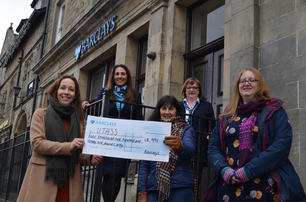 VILLAGE EFFORT: Grace Crawford, Anne Scott and Emma Spry from Utass were delighted to receive a cheque from Natasha Bradley and Diane Gamack, from Barclays Bank