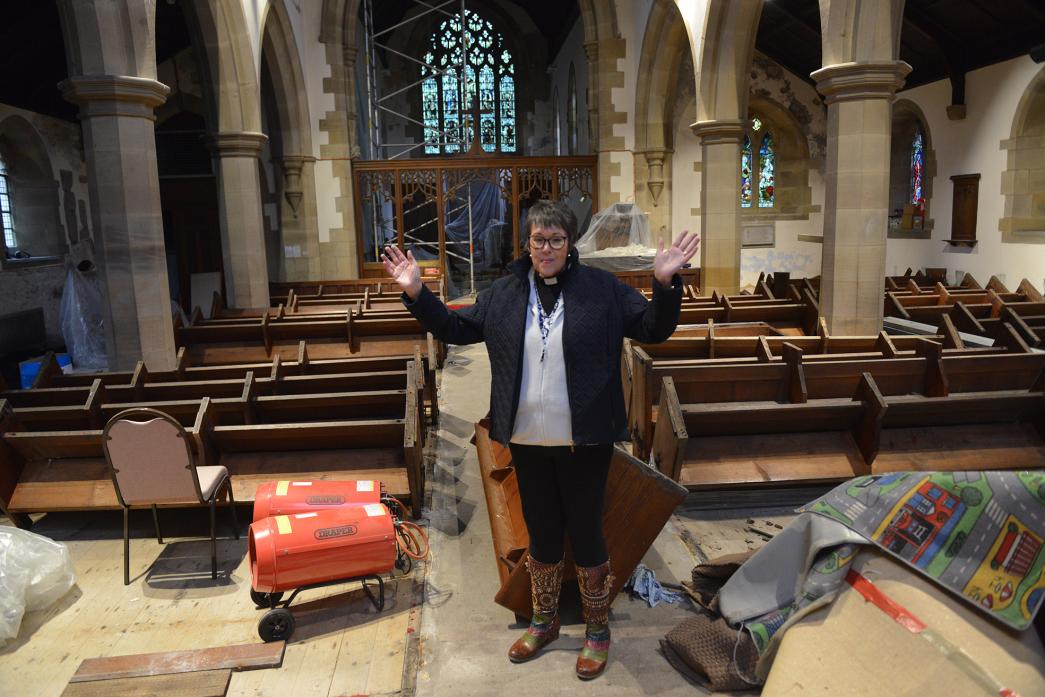 VISION: Revd Alison Wallbank stands among the upturned pews and rotting floor of St Mary’s Church