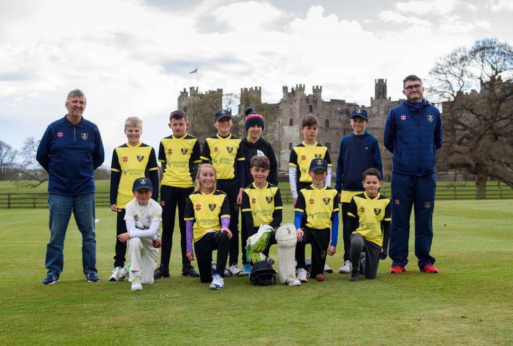 LINING UP: Raby Castle U13s line up before their game against Willington, with coaches Steve Caygill and Scott Hedley