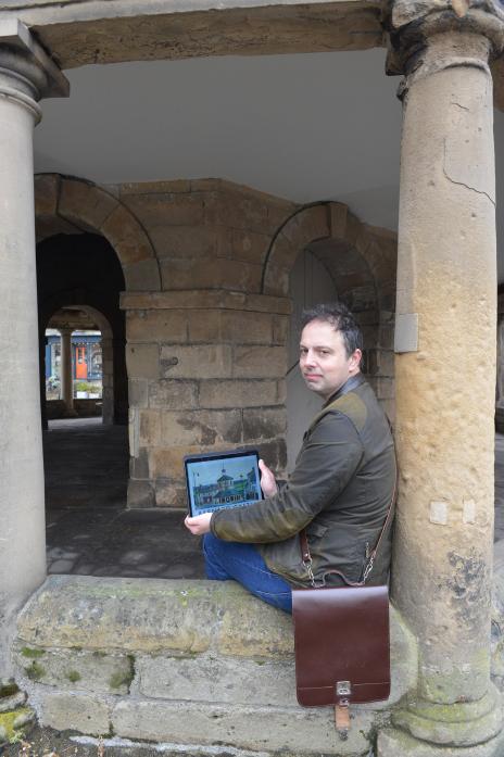 AWARD WINNING: Richard O’Neill with his drawing of the Market Cross, pictured in the Market Cross