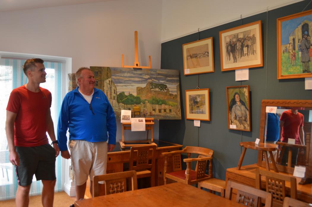TOWN ART: Charlie and Paul Ing with the remaining Pittuck paintings now on display at their Ingnet antiques shop