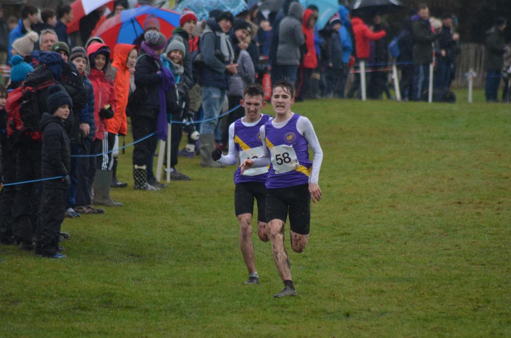 PHOTO FINISH: County Durham’s Jack Brown and Michael Wade race to the finish in the senior boys race. Below, County Durham’s Amy Jack leads runners through the heavy course