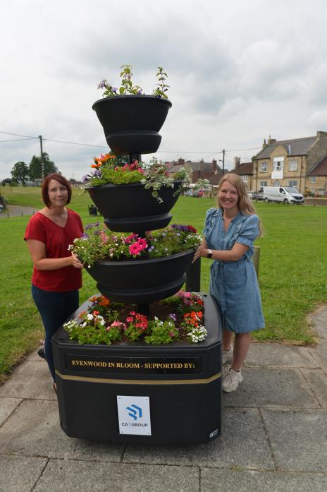 FLOWER POWER: Kay Gill and Jacqueline Gibey with one of the new planters that have appeared in Evenwood thanks to the new in-bloom group