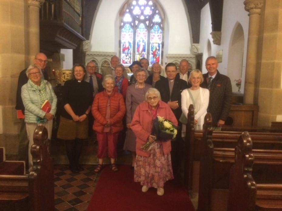 FAREWELL TO A TREASURE: Jean Tallentire, pictured with flowers, retired as organist at St Mary’s Church, Whorlton, after 70 years