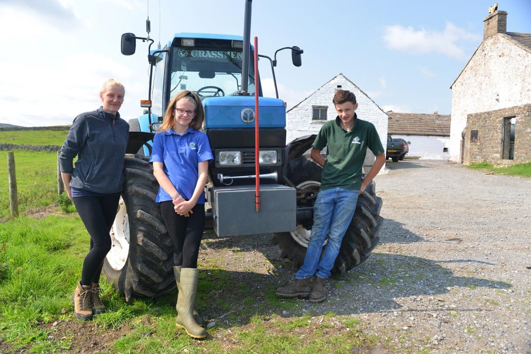 FAMILY TRIBUTE: Helen Scott and children Joe and Hannah are raising cash for The Brain Tumour Charity in honour of their husband and father Richard during a memorial tractor rally this weekend