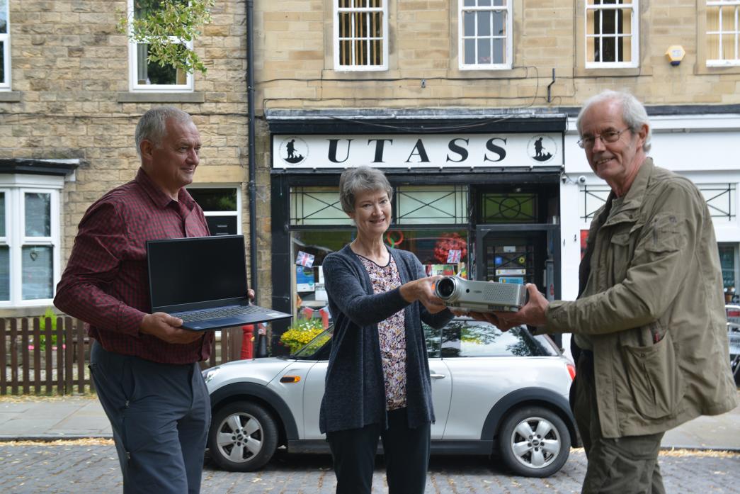IN THE FRAME: Bob Danby and Julia Steph-enson of Utass receive the laptop and projector from Martin Rogers