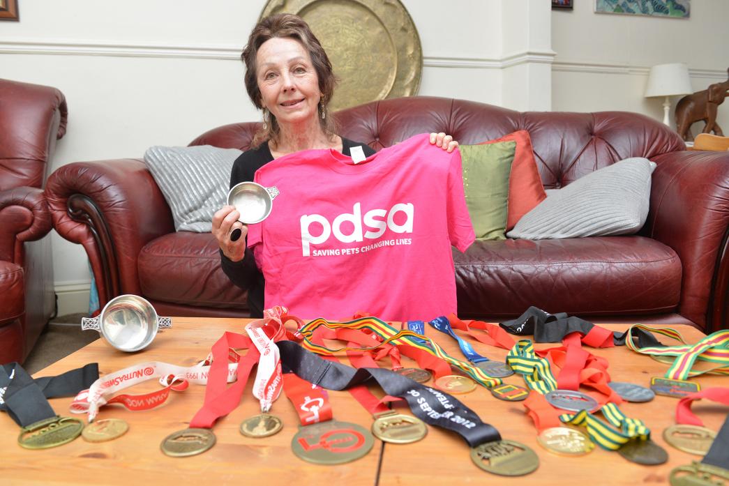 MEDAL HAUL: Animal lover Wendy Bellaris is to compete in her 22nd marathon in aid of the PDSA charity aged 77
