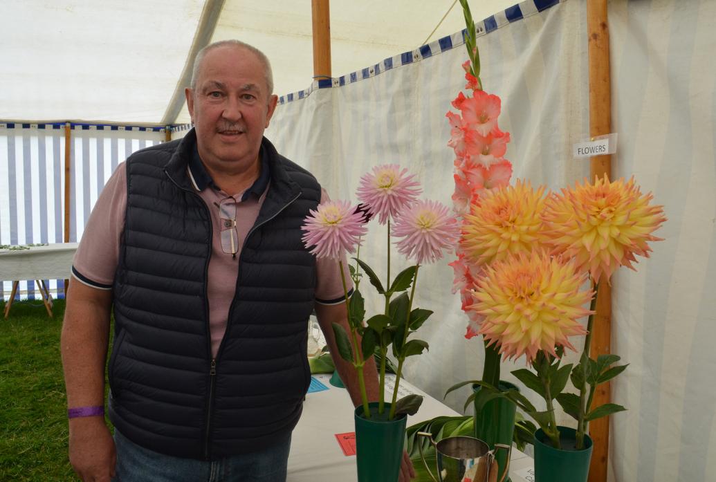 BEAUTIFUL BLOOMS: Michel Hedley with a selection of his flowers