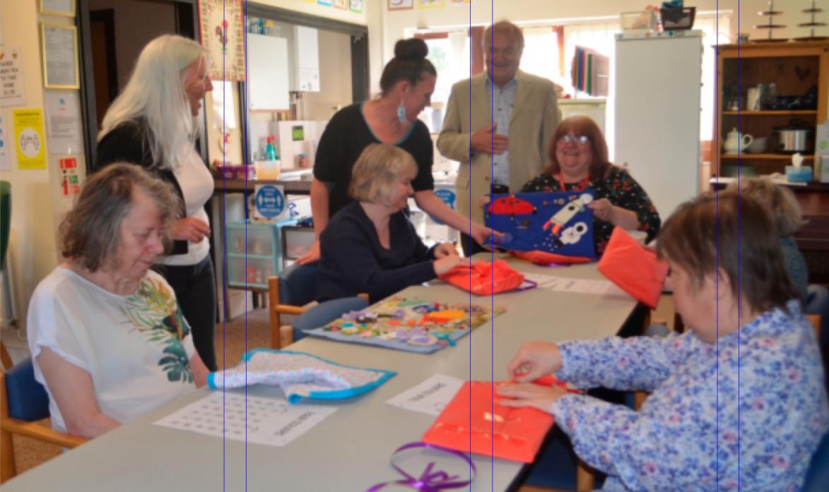 COMMUNITY SPIRIT: It was smiles all round as the latest batch of  fiddle mats, made during lockdown, are presented to Phoenix Day Care