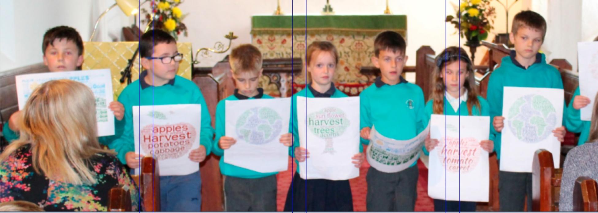 BACK IN CHURCH: Children at Bowes school during the harvest services