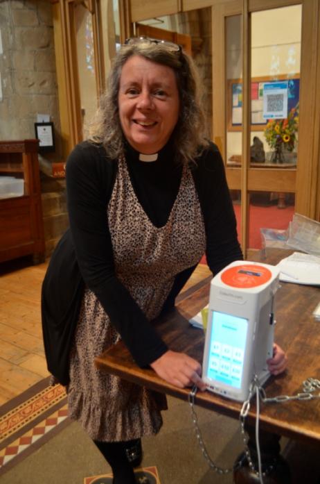 DIGITAL HELP:  Revd Sarah Cliff with the contactless collection box
