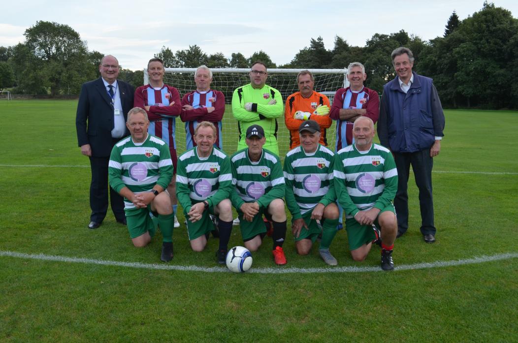 RARING  TO GO: Members of Middleton Wanderers Walking Football Club sport their new strips which were bought in part by a donation from county councillors Ted Henderson, left, and Richard Bell