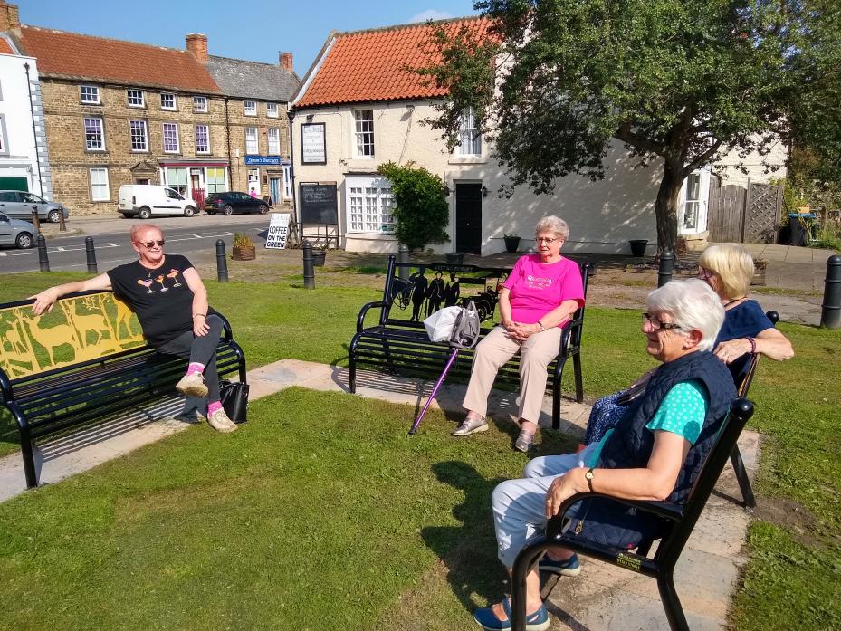 GETTING TOGETHER: Phyllis Wood and Elaine Oliver meet up with friends at the new social seating arrangement on Staindrop’s village green