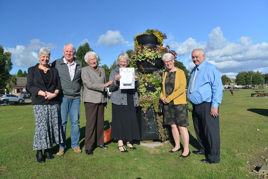 WE DID IT: Celebrating their gold award are West Auckland in Bloom volunteers Elaine and Alan Geldard, Audrey Beck, Jean Pattison, Susan Richardson and Neil Simpson                      TM pic