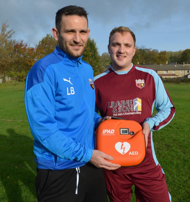 WELCOME ADDITION: Liam Bell, chairman of Middleton Wanderers FC, and club captain Dave Mitchell with the new portable defibrillator