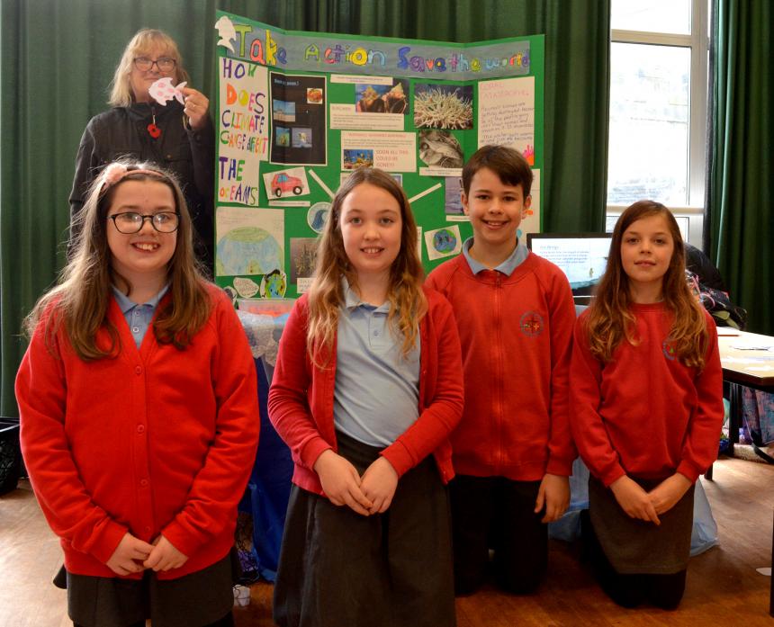MAKING A SPLASH: Viv Guy and pupils from St Mary's RC Primary highlighted the issue of rising sea levels